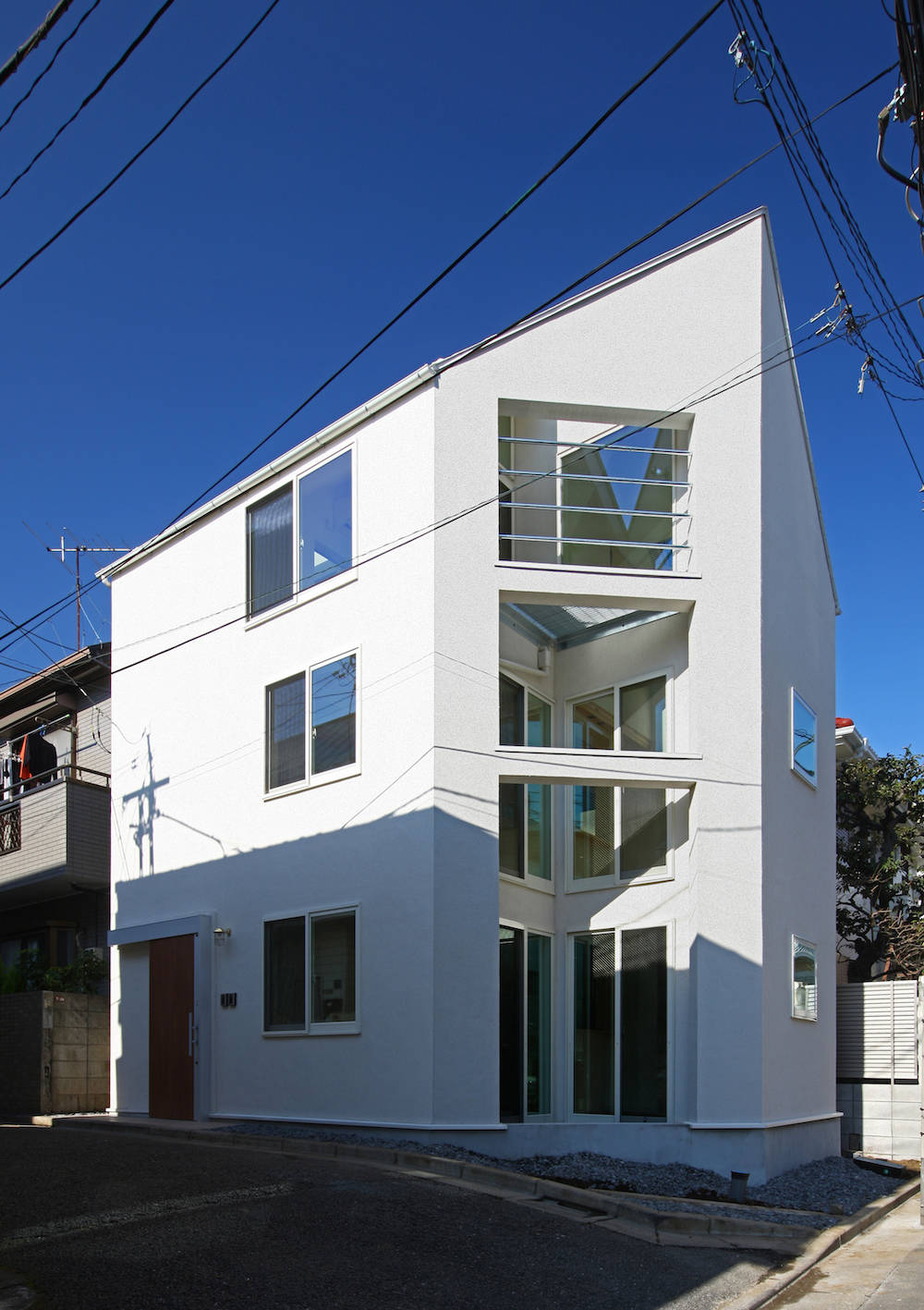 Two-Family House in Hachimanyama by Atelier Hako Architects
