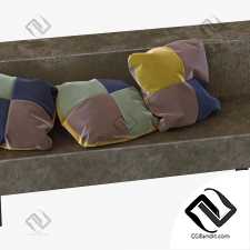 Цветные бархатные подушки на современной софе.
